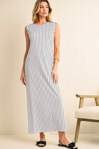 Effortlessly chic, this black and white striped maxi vest dress is perfect for casual outings or beach days. The sleeveless design, round neck, and classic stripes create a timeless, stylish look. Made from high-quality, lightweight fabric, it offers durability, comfort, and easy care. The maxi length and relaxed fit provide a flattering silhouette for various body types.