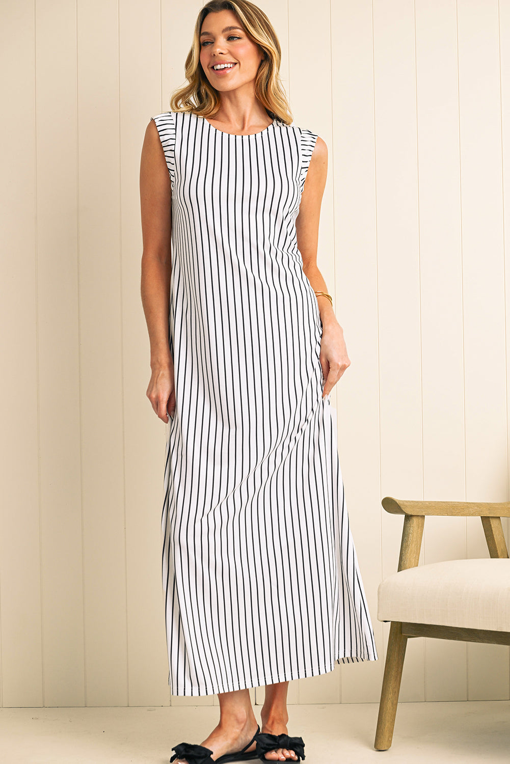 Effortlessly chic, this black and white striped maxi vest dress is perfect for casual outings or beach days. The sleeveless design, round neck, and classic stripes create a timeless, stylish look. Made from high-quality, lightweight fabric, it offers durability, comfort, and easy care. The maxi length and relaxed fit provide a flattering silhouette for various body types.