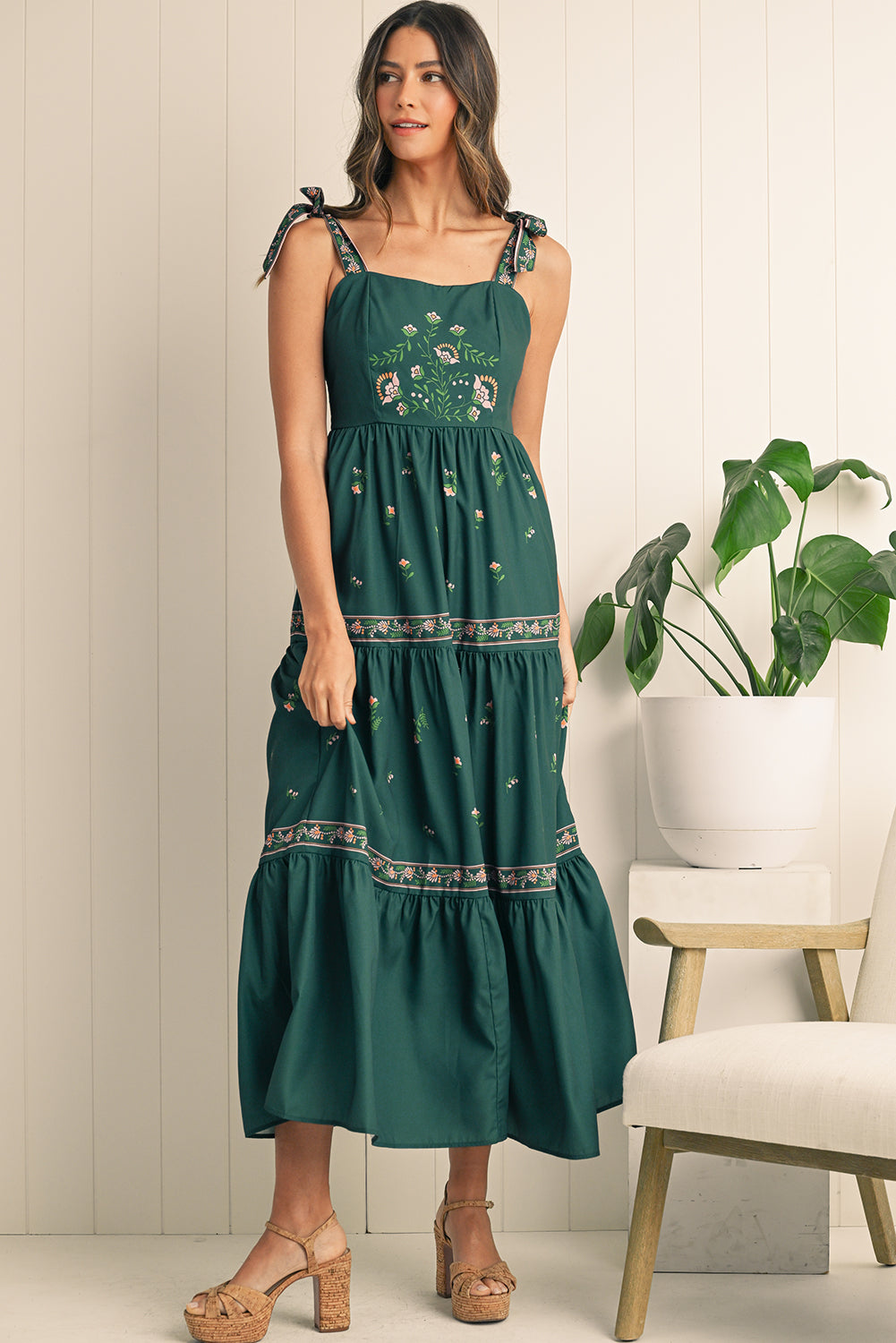 Turn heads in this blackish green boho floral sleeveless dress with a trendy waist knot detail for a bohemian vibe. The vibrant floral print adds femininity, perfect for summer outings or casual gatherings. Stay cool and stylish with the sleeveless design, offering comfort and freedom of movement. The flattering silhouette works for any occasion, pairing with heels for nights out or sandals for daytime looks.