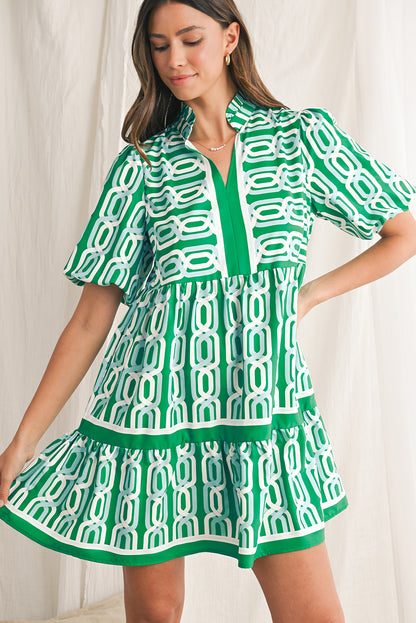 Vibrant green hue with an eye-catching abstract print, perfect for making a bold statement in any setting. V-neckline adds a touch of femininity, while puff sleeves bring a trendy and playful element to the design. Flirty mini length enhances the legs and silhouette, ideal for showcasing your style with confidence. Boho-inspired frill detailing along the neckline and hemline adds a touch of whimsy and charm to the overall look.