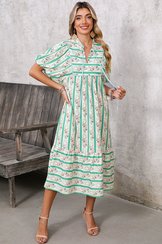 Blend boho and floral vibes with this long dress, perfect for casual or chic occasions. The striped pattern adds sophistication, while the V-neckline and tie detail create a flattering silhouette. Convenient pockets combine practicality with style for on-the-go essentials. The vibrant multicolor design ensures you stand out, making this dress a versatile wardrobe addition.