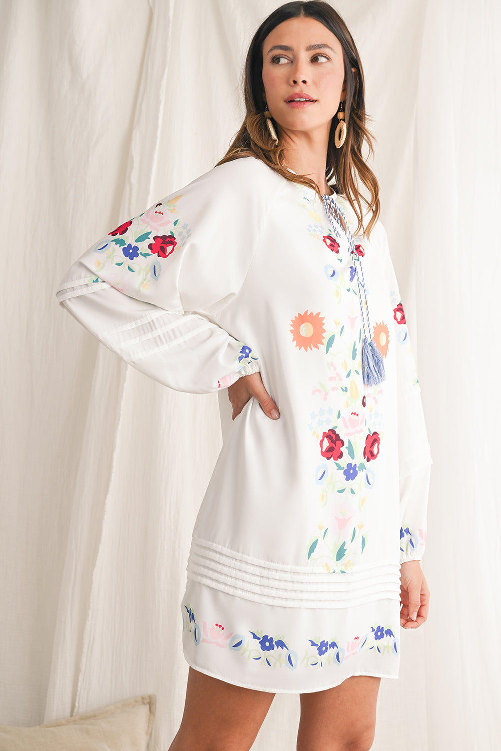 Embrace bohemian elegance with our White Boho Floral Tassel Tie V Neck Mini Dress, featuring delicate floral prints that exude a whimsical charm. The tassel tie neck adds a touch of playfulness to this chic dress, perfect for a casual day out or a relaxed evening gathering. Crafted from high-quality materials, this dress offers both style and comfort, making it a versatile piece for various occasions. The mini length of the dress adds a flirty and youthful vibe, ideal for showcasing your individual style wi