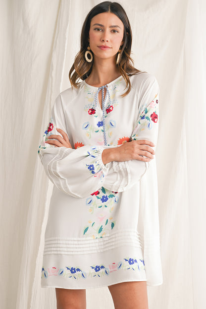 Embrace bohemian elegance with our White Boho Floral Tassel Tie V Neck Mini Dress, featuring delicate floral prints that exude a whimsical charm. The tassel tie neck adds a touch of playfulness to this chic dress, perfect for a casual day out or a relaxed evening gathering. Crafted from high-quality materials, this dress offers both style and comfort, making it a versatile piece for various occasions. The mini length of the dress adds a flirty and youthful vibe, ideal for showcasing your individual style wi