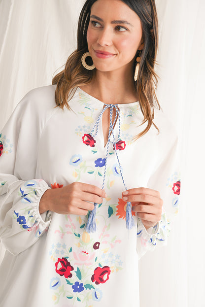 Embrace bohemian elegance with our White Boho Floral Tassel Tie V Neck Mini Dress, featuring delicate floral prints that exude a whimsical charm. The tassel tie neck adds a touch of playfulness to this chic dress, perfect for a casual day out or a relaxed evening gathering. Crafted from high-quality materials, this dress offers both style and comfort, making it a versatile piece for various occasions. The mini length of the dress adds a flirty and youthful vibe, ideal for showcasing your individual style wi