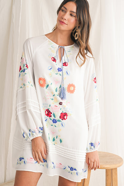 Embrace bohemian elegance with our White Boho Floral Tassel Tie V Neck Mini Dress, featuring delicate floral prints that exude a whimsical charm. The tassel tie neck adds a touch of playfulness to this chic dress, perfect for a casual day out or a relaxed evening gathering. Crafted from high-quality materials, this dress offers both style and comfort, making it a versatile piece for various occasions. The mini length of the dress adds a flirty and youthful vibe, ideal for showcasing your individual style wi